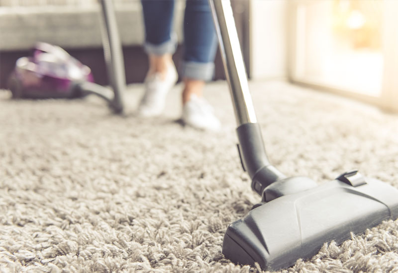 home-cleaner-cleaning-carpets